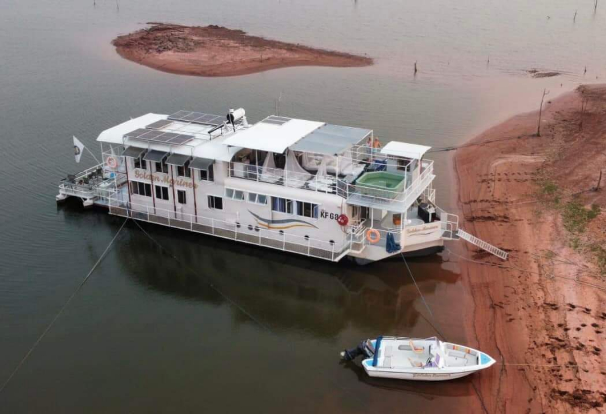 Golden Mariner houseboat anchored on the calm waters of Lake Kariba